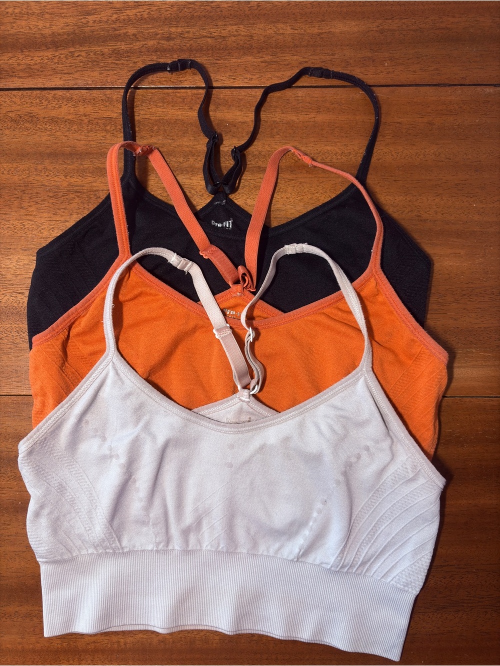 3 Pro-Fit Women’s Seamless Racerback Bralette - White, Orange, Black